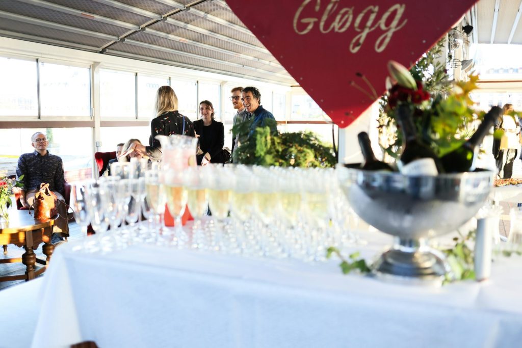 Champagne glasses and bottles on a table at an event.